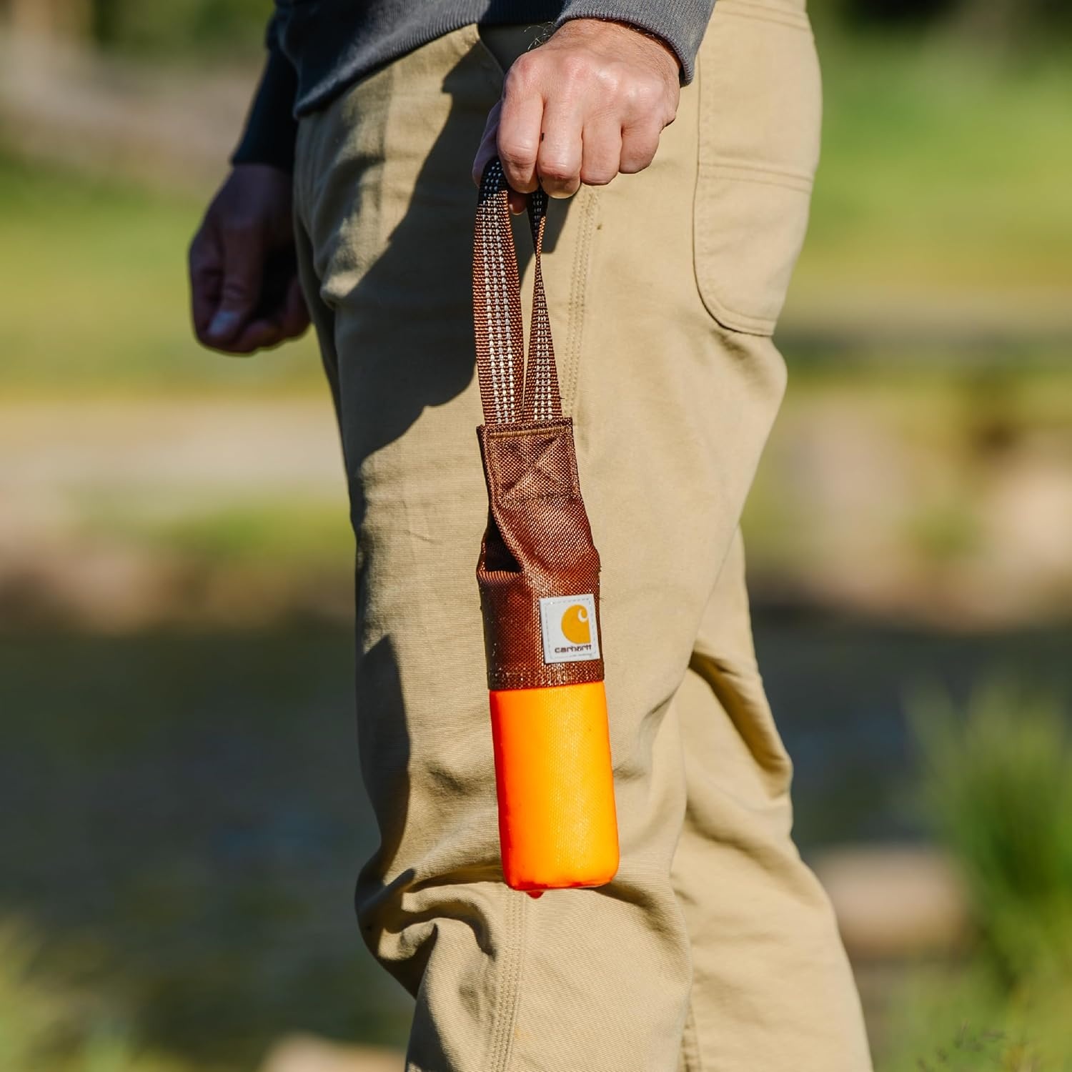 imageCarhartt Pet Training Tool Dog Retrieving Bumper Rugged Nylon Duck Canvas Training Bumper Designed for Retrieval Training Hunter Orange SmallHunter Orange